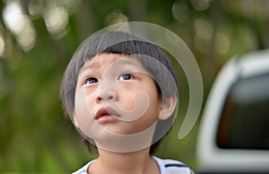 Close up a little boy looking up