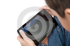 Close up little boy playing tablet game