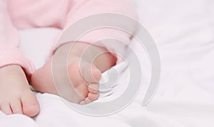 Close up little foots of sleeping cute baby