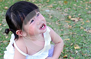 Close-up little girl crying in park