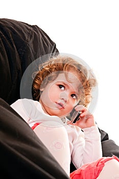 Close-up of a little girl holding phone