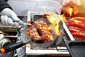 Close up Lobster burned on charcoal, street food 