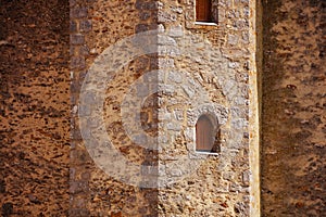 Close-up of loophole window in medieval stronghold castle tower