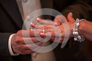 Close-up: Loving Bride and Groom Exchanging Wedding Rings - Marry Me Concept