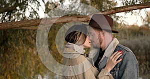 Close up loving couple under a tree in the park