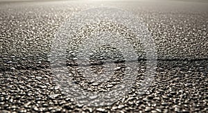 Asphalt Road Surface Texture with Sunlight Reflections