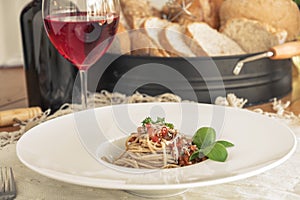 Close up low angle view of a plate of spaghetti topped with delicious bolognaise sauce photo