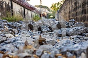 Close-up low-angle view of rubble heaps of broken concrete roads