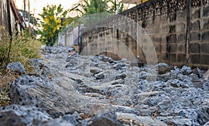 Close-up low-angle view of rubble heaps of broken concrete roads