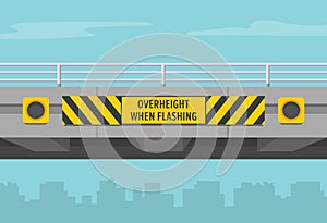 Close-up of a low bridge or overpass with obstruction and hazard marker. Overheight with amber flashers.