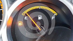 Close up low fuel guage shown in a car