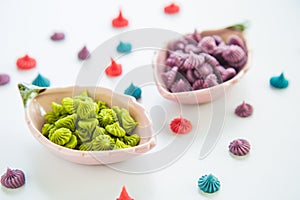 Close up A-lua or Allure Thai handmade candy in mini bowl on white destop. A-lua or Allure is traditional Thai desserts sweet