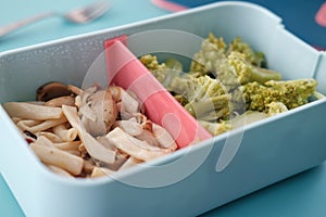 close up of lunch box pasta on table