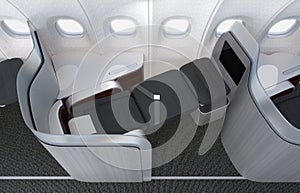 Close-up of luxurious business class seat with frosted acrylic partition.