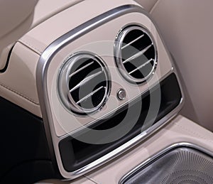 A close up of luxurious car rear side air vent photo