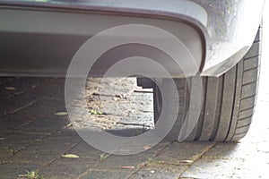 Close up of luxury car tyres in home driveway