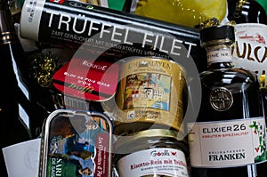 Close up of luxury christmas gift hamper basket with whole food truffle products, wine and champaign