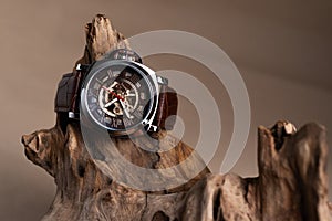 Close up of Luxury man wrist watches placed on timber in brown background or isolated