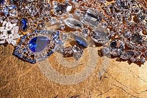 Close up of luxury precious jewelry on golden background
