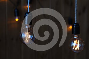 Close up of luxury round light bulbs in a vintage living room. Vintage lightbulb on dark background.