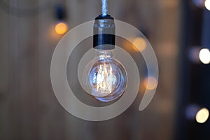 Close up of luxury round light bulbs in a vintage living room. Vintage lightbulb on dark background.