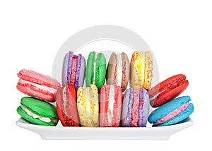 Macaron cookies on a rectangular plate, isolated