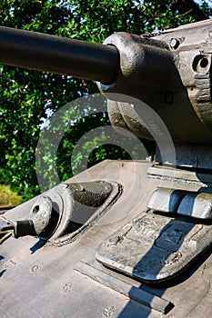 Close up of machine gun and metal hatch on soviet tank from Second World War II. Selective focus on machine gun