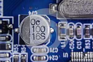 Close up macro of aluminum electrolytic capacitors installed on