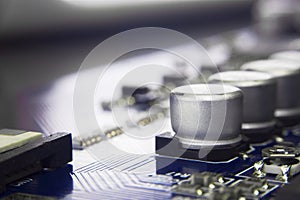 Close up macro of aluminum electrolytic capacitors installed on