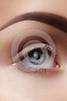 Close-up macro of beautiful female eye. Clean skin, fashion naturel make-up