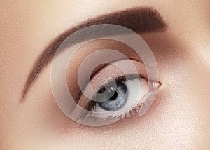 Close-up macro of beautiful female eye. Clean skin, fashion naturel make-up