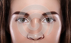 Close-up Macro of Beautiful Female Eye with Perfect Shape Eyebrows. Clean skin, Fashion Naturel Make-Up. Good Vision