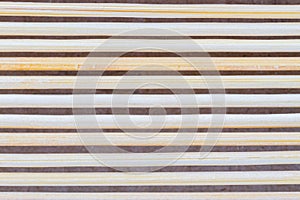 Close up macro of beige brown bamboo mat as striped background t