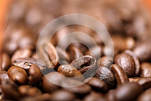 Close up macro a group roasted brown or black coffee grains background. Close up coffee beans