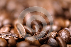 Close up macro a group roasted brown or black coffee grains background. Close up coffee beans