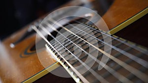 Close up macro on guitar with focus shift on strings or chords. Musical instrument. Music and sound concept