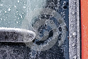 Close-up, macro image of a heavily frosted windshield of an automobile.