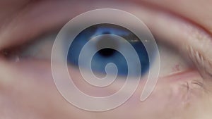 Close up macro image of human eye with blue iris