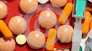 Close up macro medication, pills and drugs lying on table