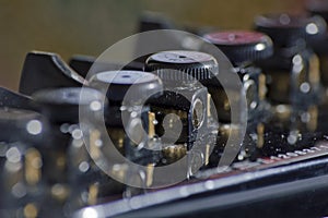 Close up macro of open gear guitar tuners.