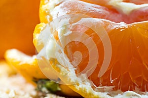 Close up macro peeled fresh orange fruit with orange pulps.