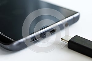 close-up macro photography USB Type-C. usb-c cable and smartphone