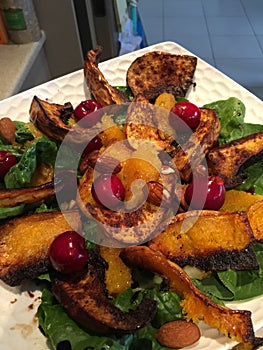 Close up macro shot of baked dish - sweet potato salad with nuts