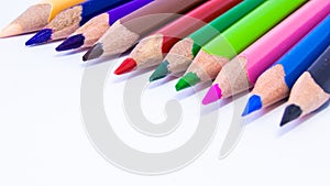 Close up macro shot of color pencil pile pencil nibs, used pencils from a school art room