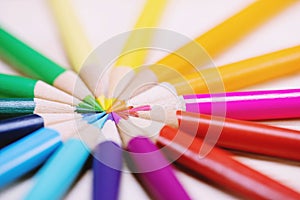 Close up macro shot of color pencils pile pencil tipped nibs Diagonal in a circle