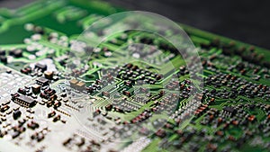 Close-up Macro Shot of the Electronic Factory at Work: A printed circuit board is composed of an automated robotic arm