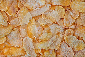 Close up macro view of cornflakes isolated. Beautiful healthy food texture background