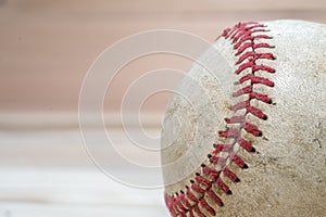 Close up macro view of the seams on a used baseball