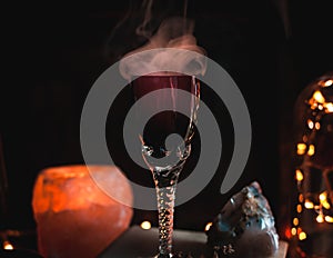 Close-up of magic potion in a glass. Magic and wizardry concept photo