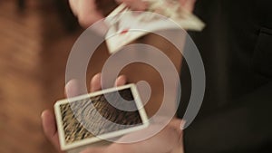 Close-up of a Magician`s Hands Performing Card Trick